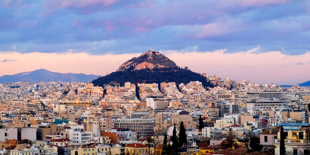 Mount Lycabettus behind Athens city skyline in Greece
