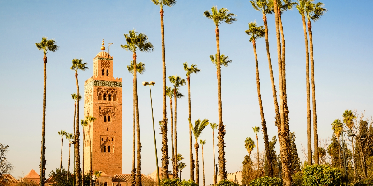 Koutoubia Mosque, minaret with palm trees in Marrakech, Morocco