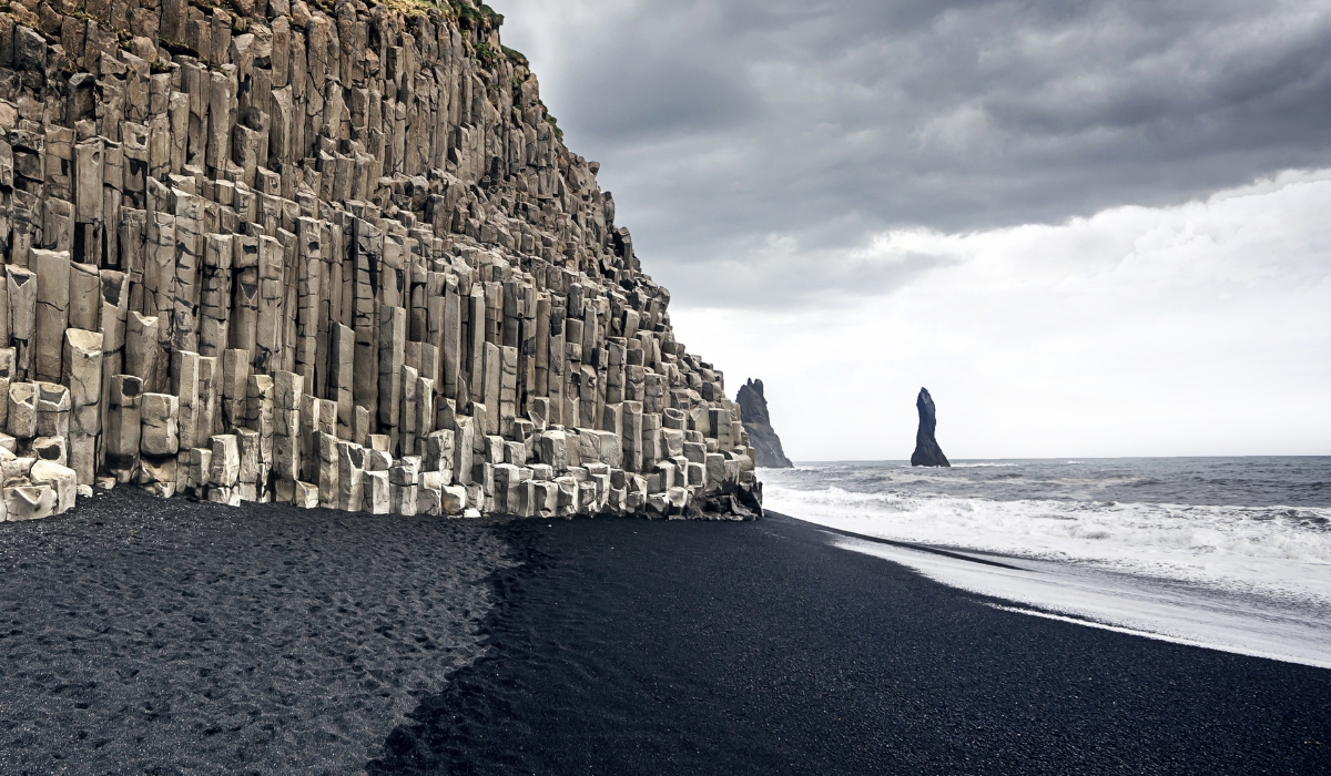 Reynisfjara black sand beach and basalt rock formation near Vik, Iceland