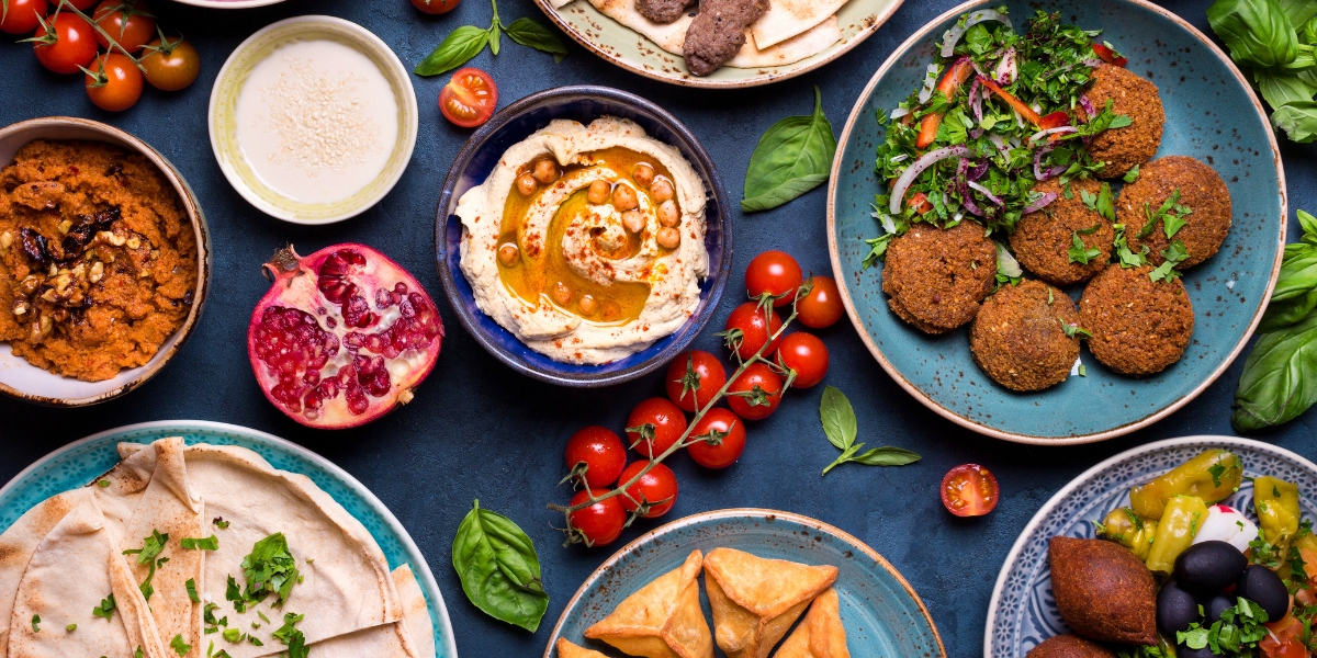 Mezze Middle Eastern cuisine. Halal food of kebab meat, falafel, baba ghanoush, muhammara, hummus, pita, and more