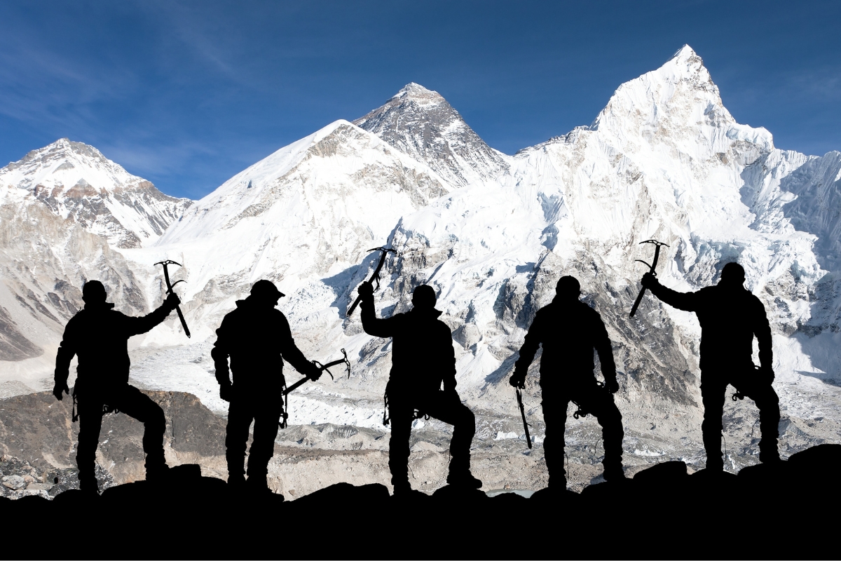 Mount Everest and silhouette of climbers at Himalayas, Nepal