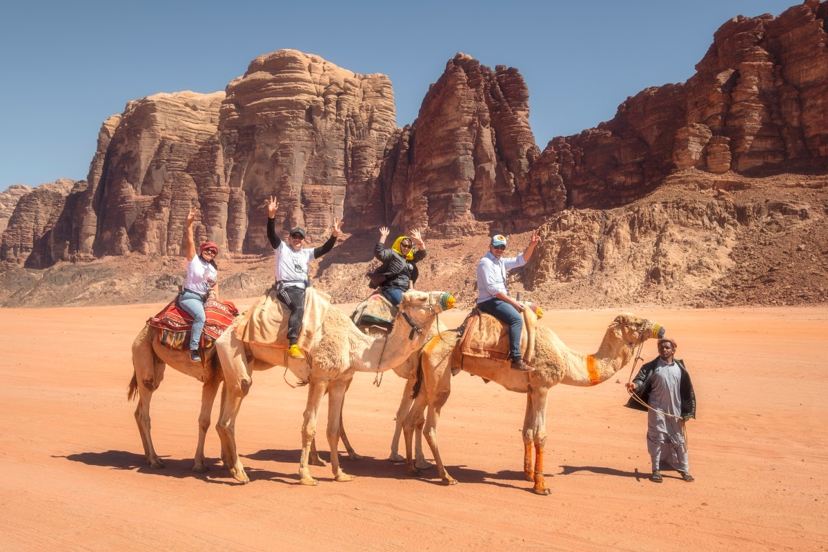 Riding camels in Wadi Rum, Jordan