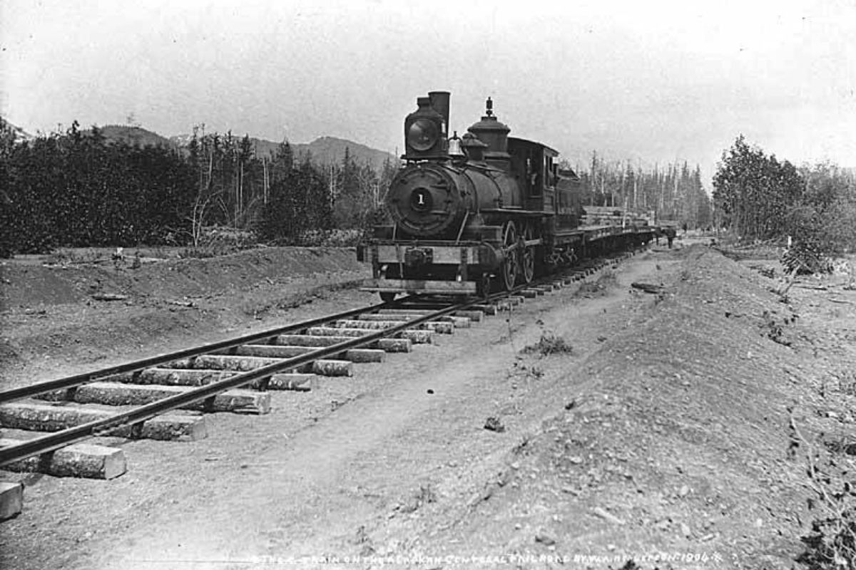 Locomotive pulling flatcars, Alaska Central Railroad, Alaska, 1904