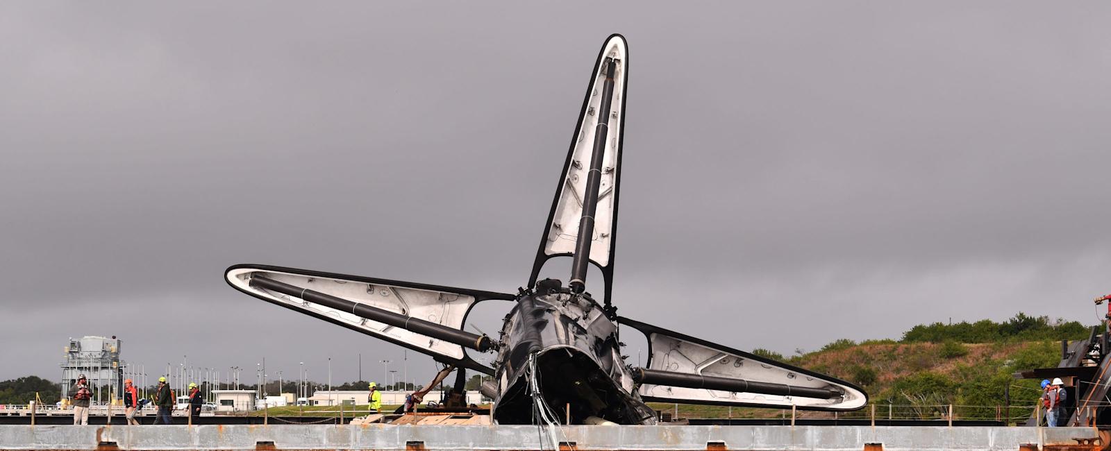 Bashed-up SpaceX Falcon 9 rocket booster returns to Port Canaveral