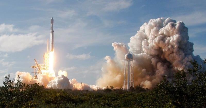 A SpaceX Falcon Heavy rocket lifts off from the Kennedy Space Center in Cape Canaveral