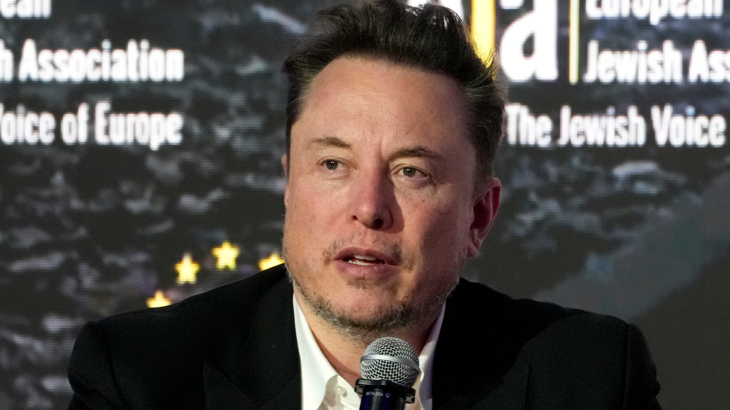 Elon Musk says he’s boosting Tesla pay to stop OpenAI from poaching