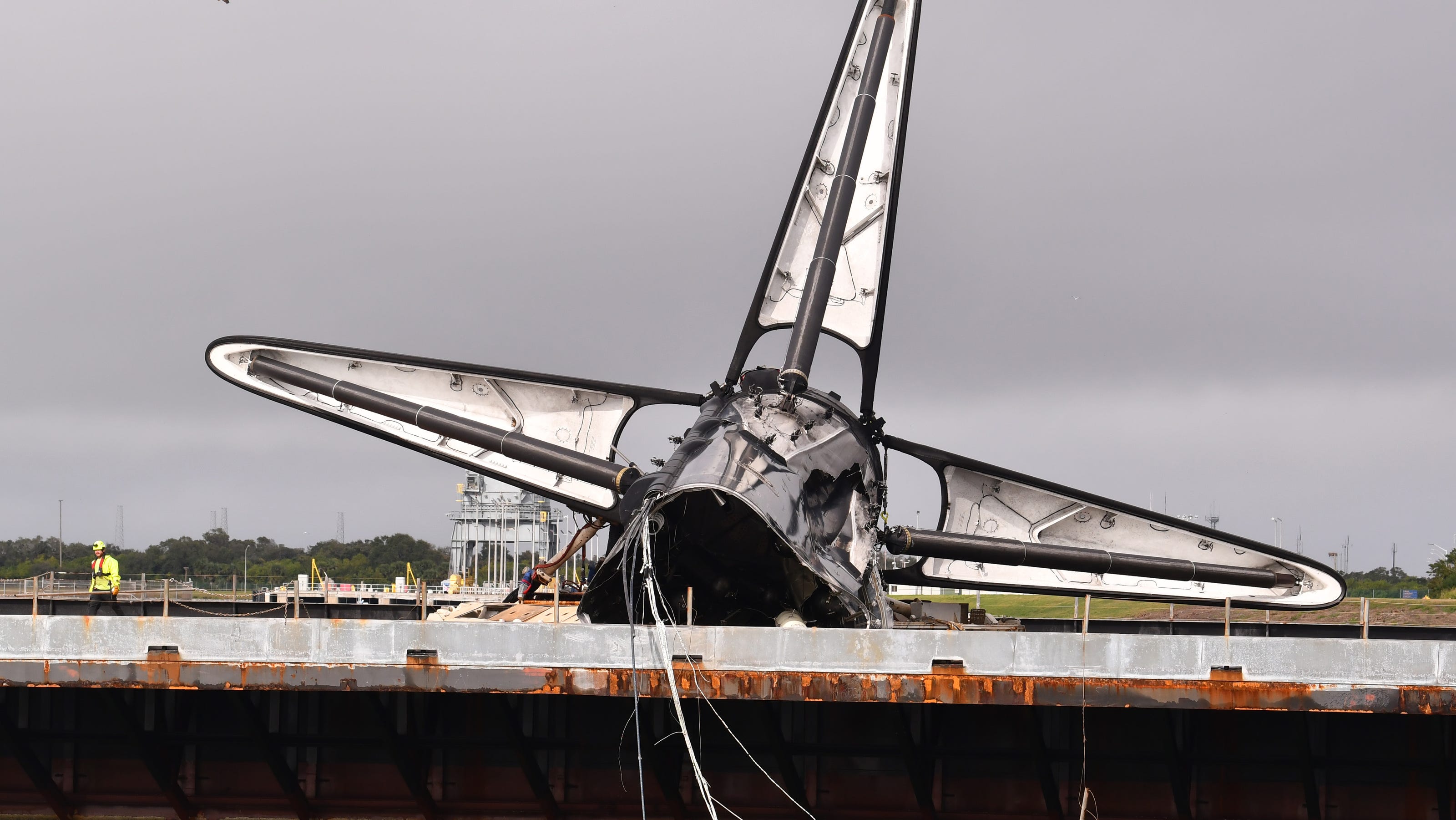 SpaceX Falcon 9 bashed up booster back at Florida cruise ship port
