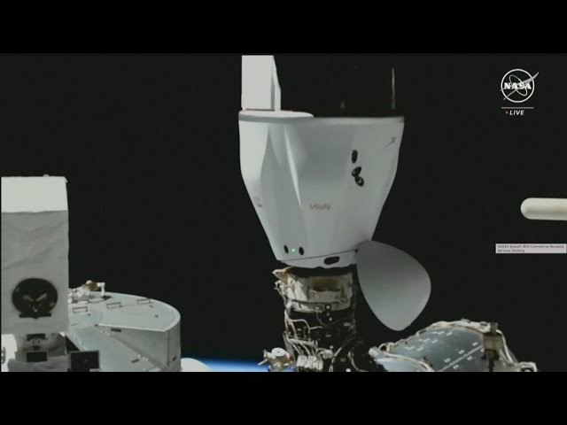 SpaceX Dragon cargo spacecraft docks at International Space Station