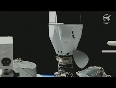 SpaceX Dragon cargo spacecraft docks at International Space Station
