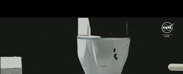 SpaceX Dragon cargo spacecraft docks at International Space Station