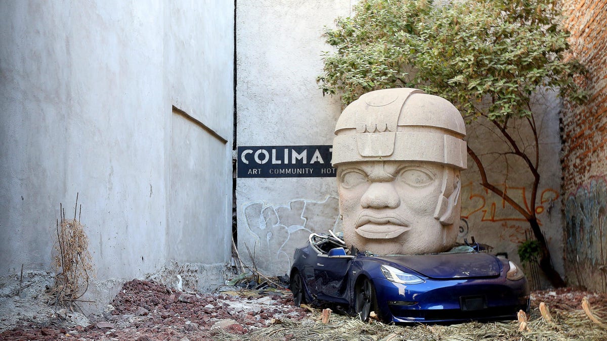 Mexican Artist Crushes Tesla Model 3 Under 9-Ton Statue