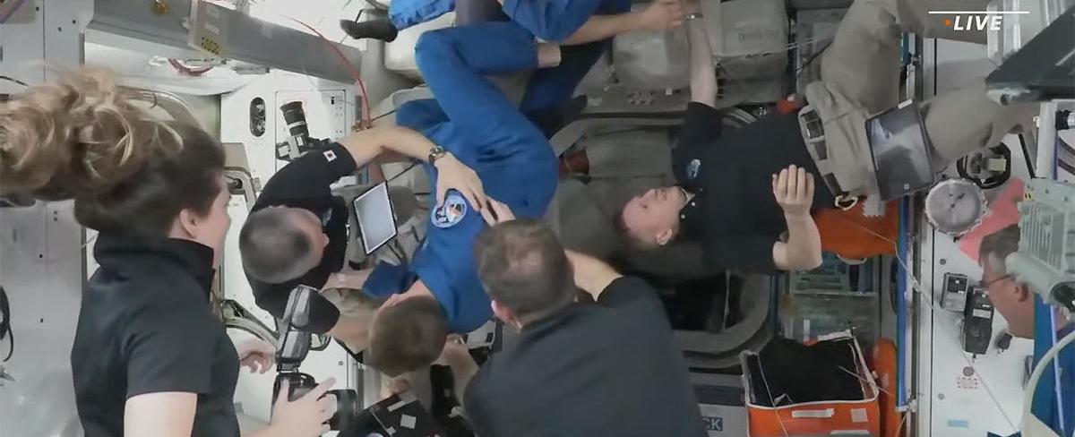 SpaceX Crew Dragon docks at space station, delivering three-country, four-man crew for six-month stay