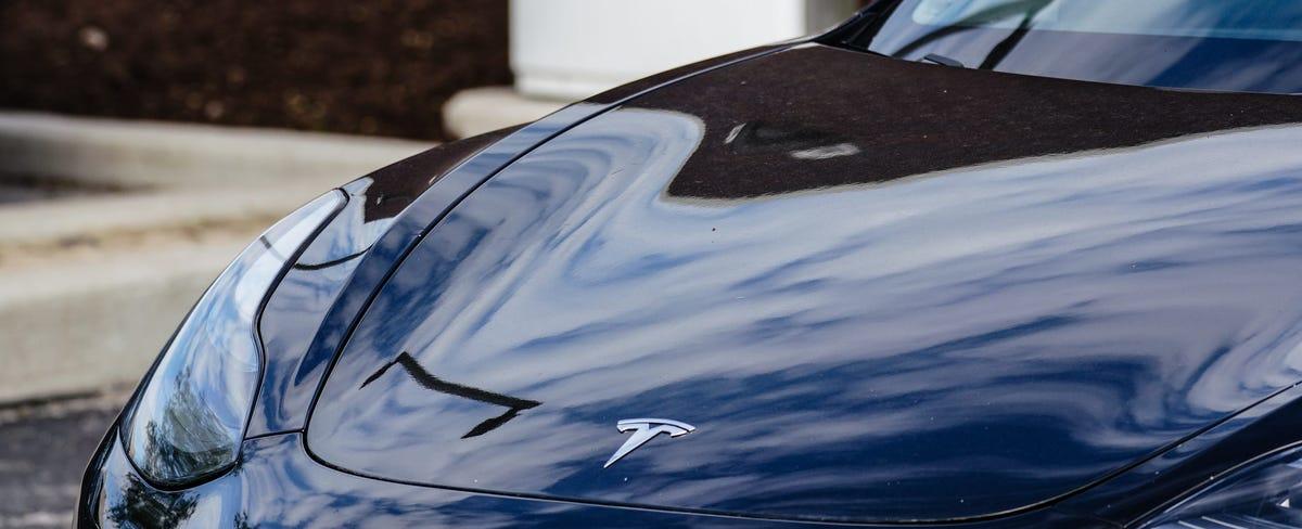 Tesla shares dip after report on scrapping plans to build low-cost EV