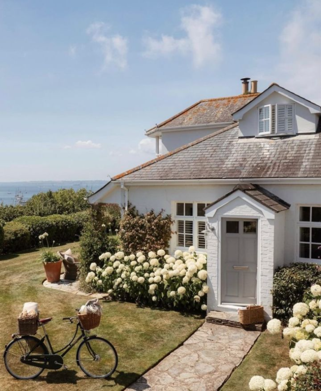 house by the sea with bicycle