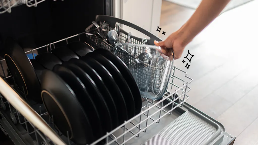 Person loading dishes into a dishwasher