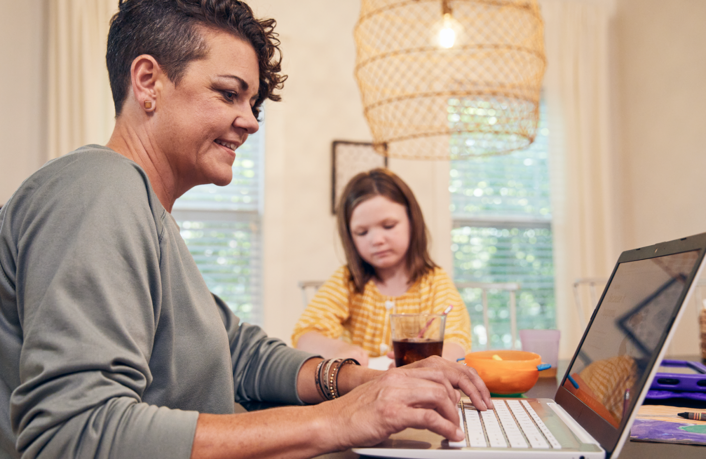 Woman using laptop in home