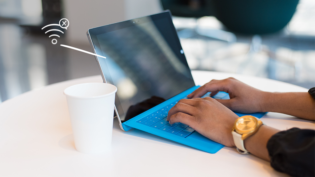 Person typing on Surface Pro that won't connect to internet