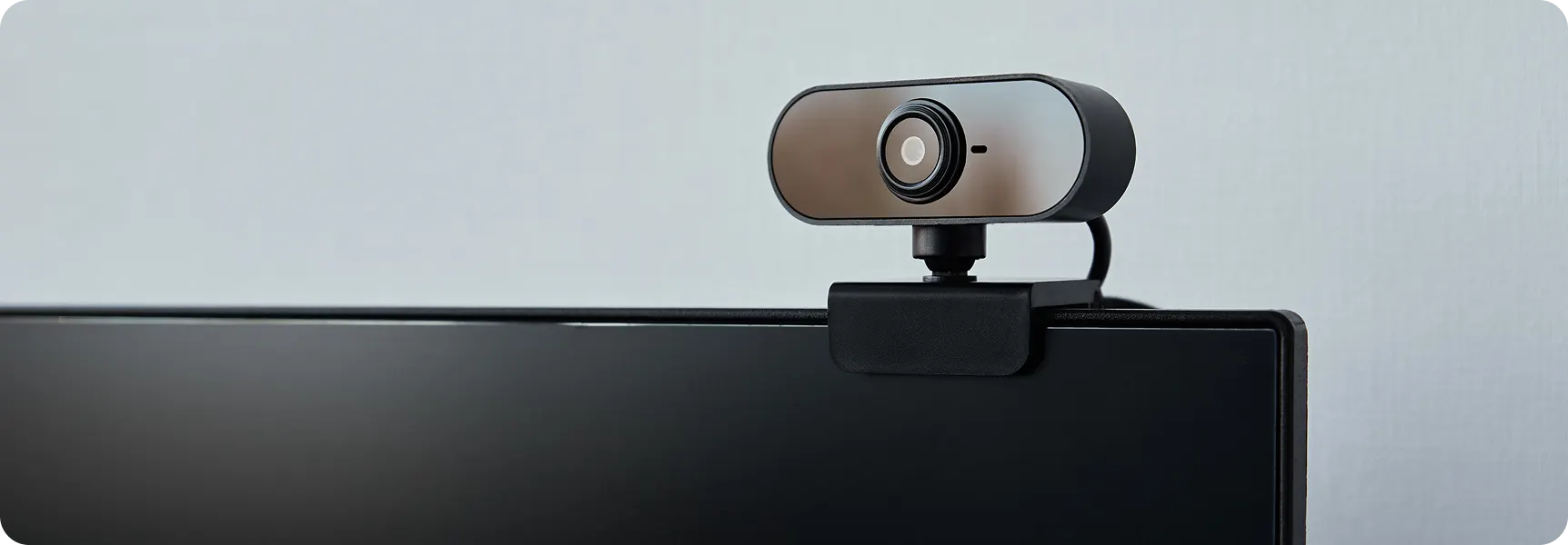 External webcam mounted on top of a computer monitor
