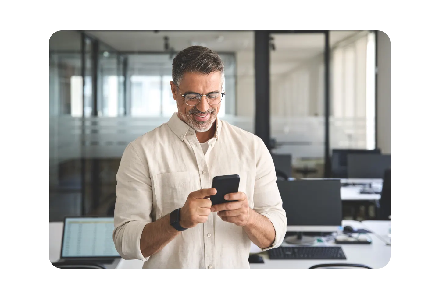 Man using phone and smiling