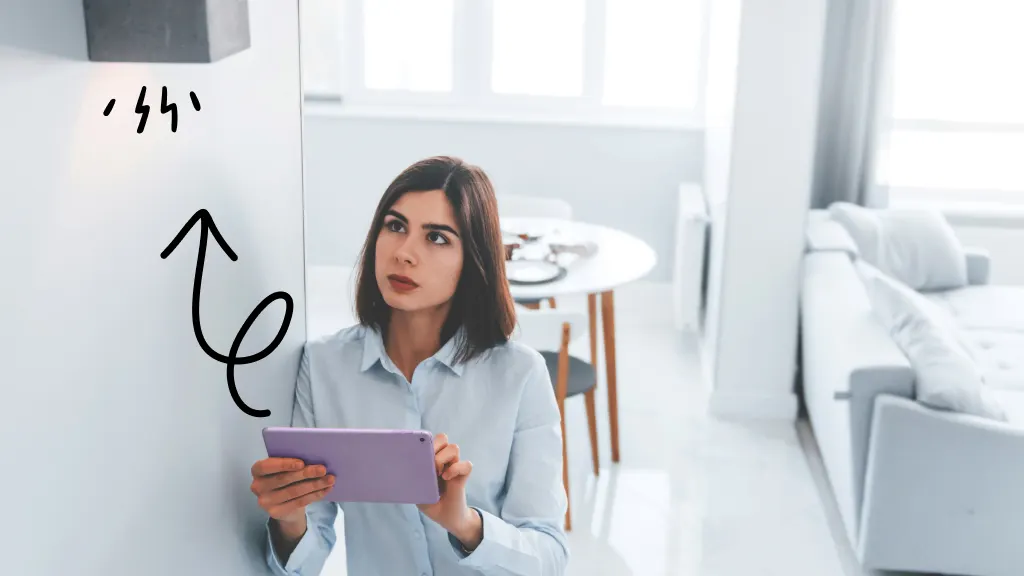 Woman controlling smart lights with tablet