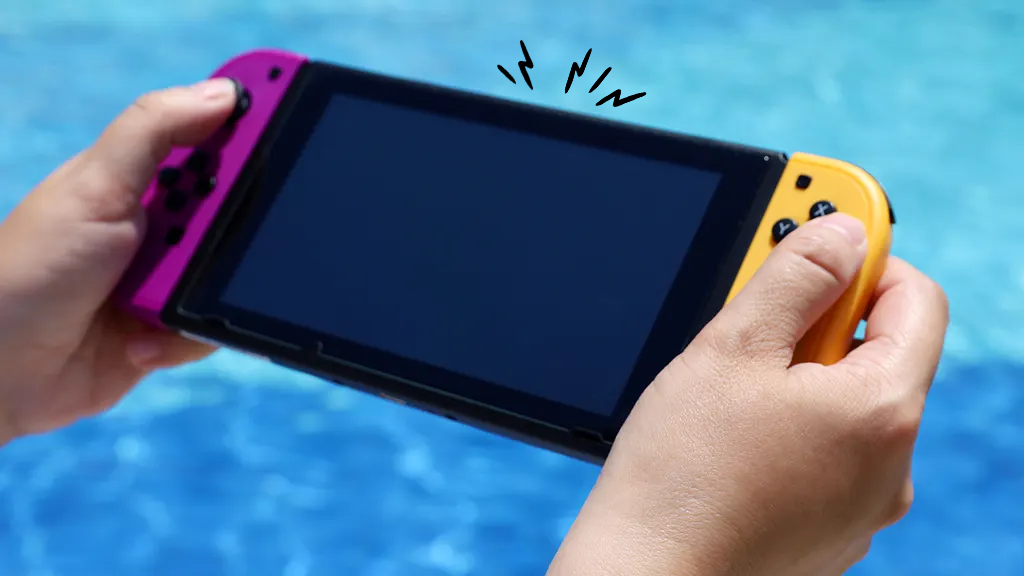 Person holding Nintendo Switch near pool