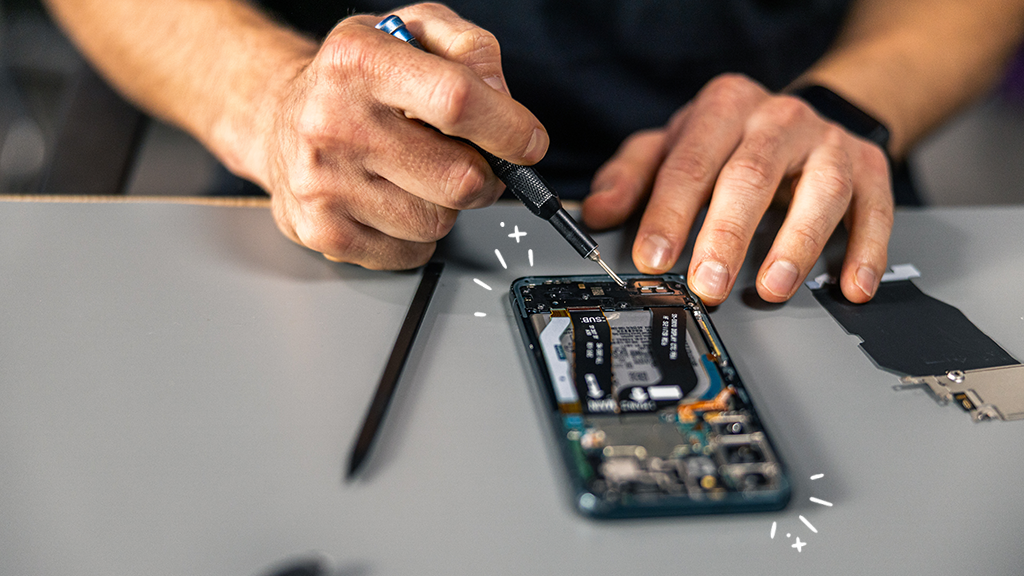 A phone being fixed by a phone repair expert at uBreakiFix by Asurion