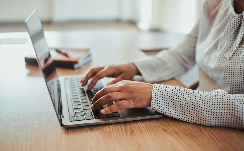 person typing on computer