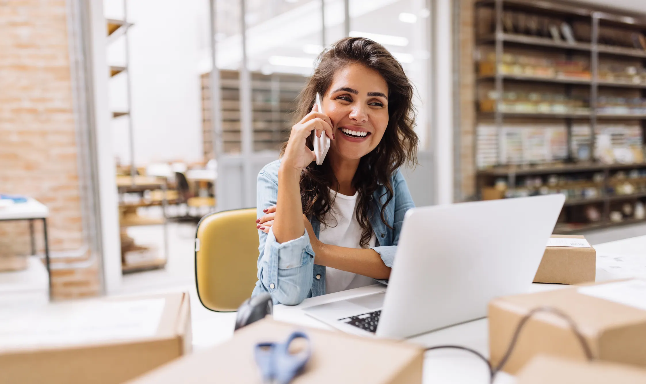 women on phone smiling 