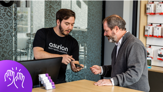 An Asurion expert helping a customer with their phone