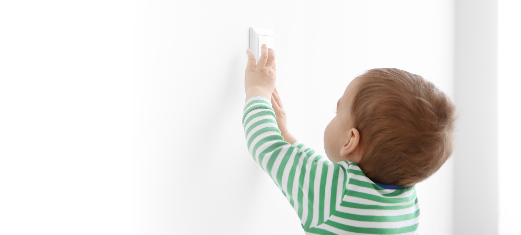 Baby touching smart light switch