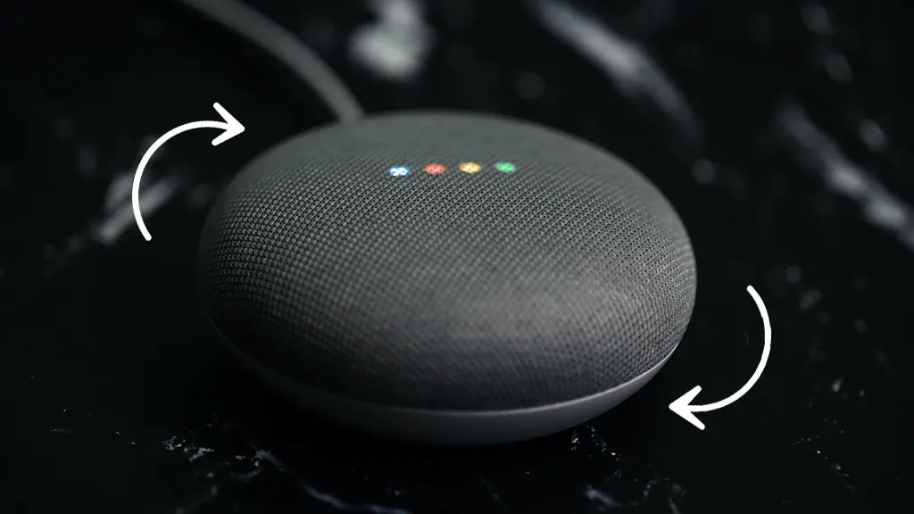 Resetting black Google Home Mini sitting on table