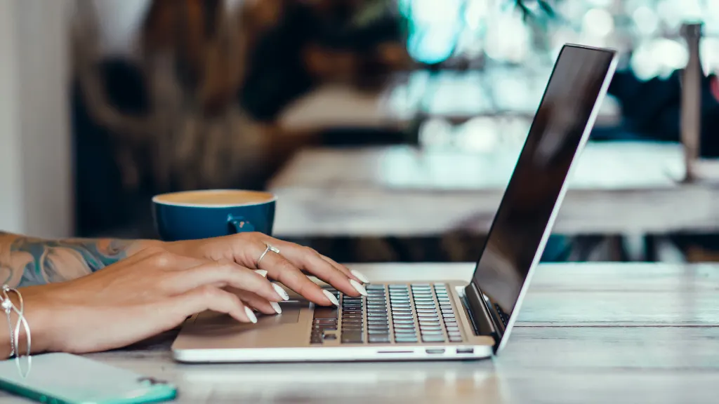 Woman using Macbook and the screen is black