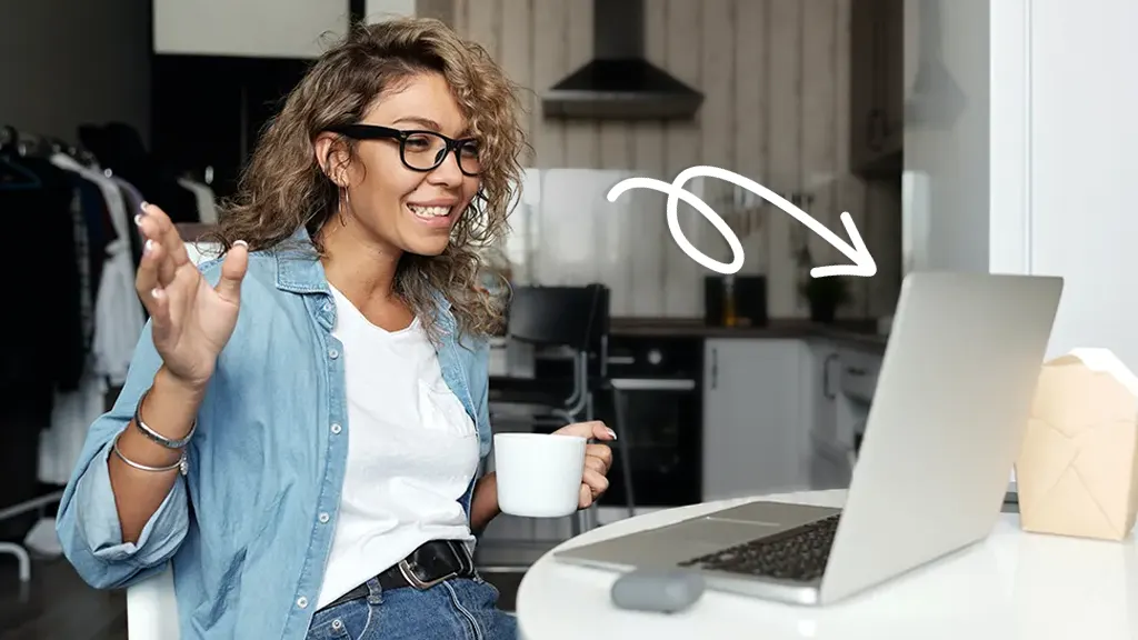 Woman using MacBook camera for video chat