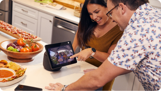 Couple uses a tablet to view their front door camera