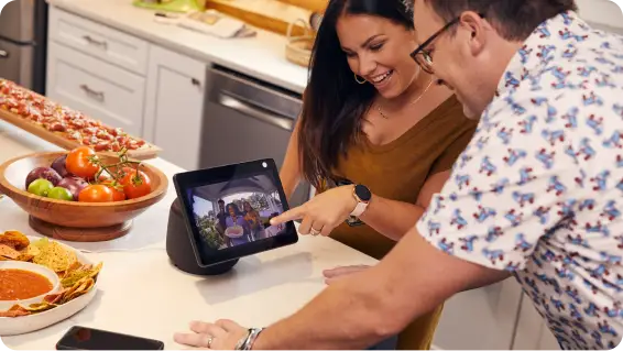 Couple uses a tablet to view their front door camera
