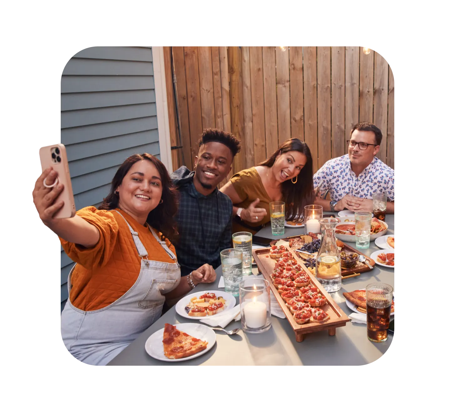 Friends taking selfie at an outdoor table