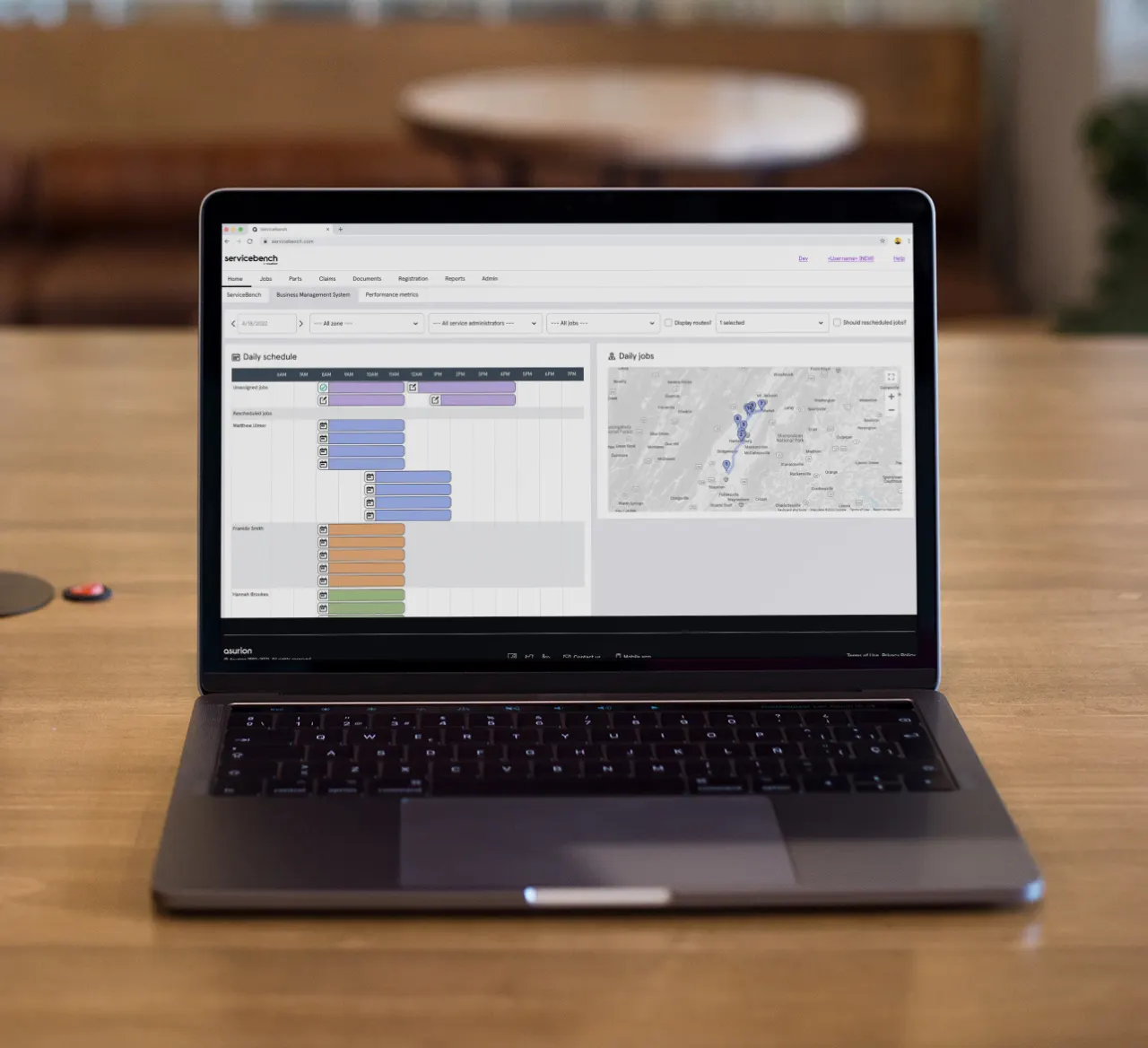 A laptop showing service management software
