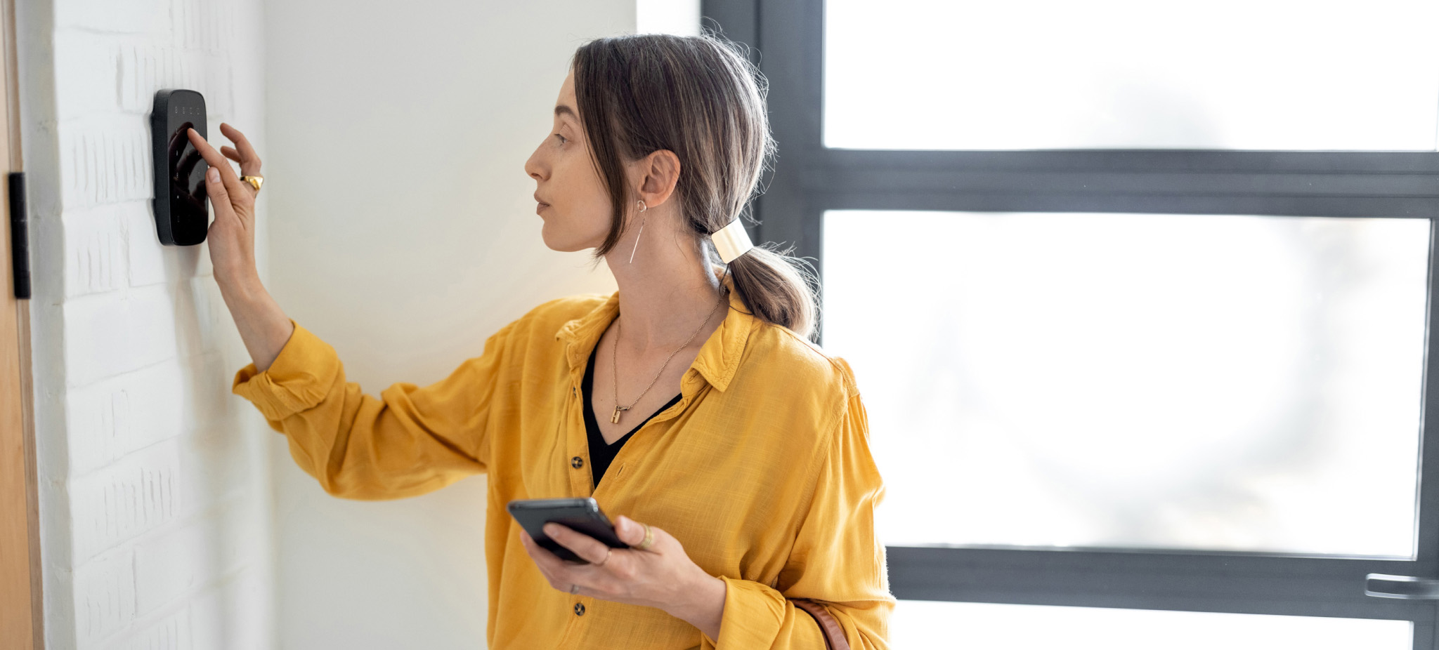 Woman using smart door lock