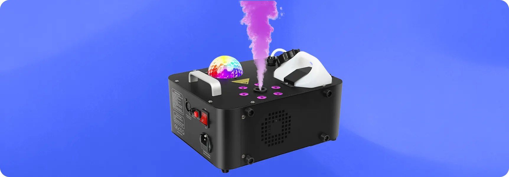 Fog machine with colorful lights producing smoke for party or event lighting effects.