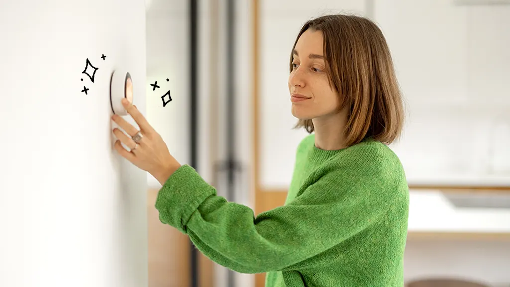 Woman in her home using surprising features of a smart thermostat