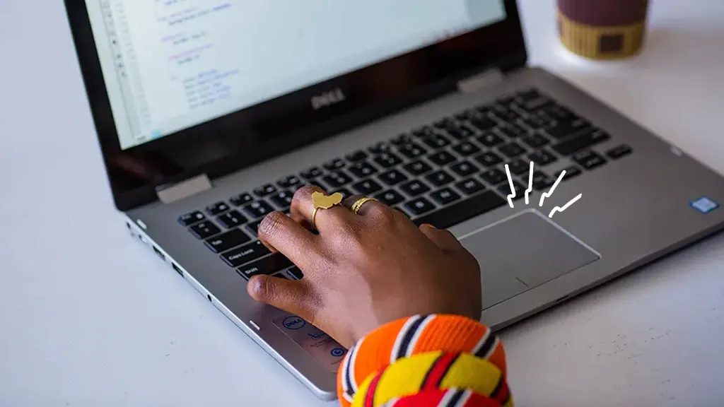 Person's hand on Dell laptop with touchpad that's not working