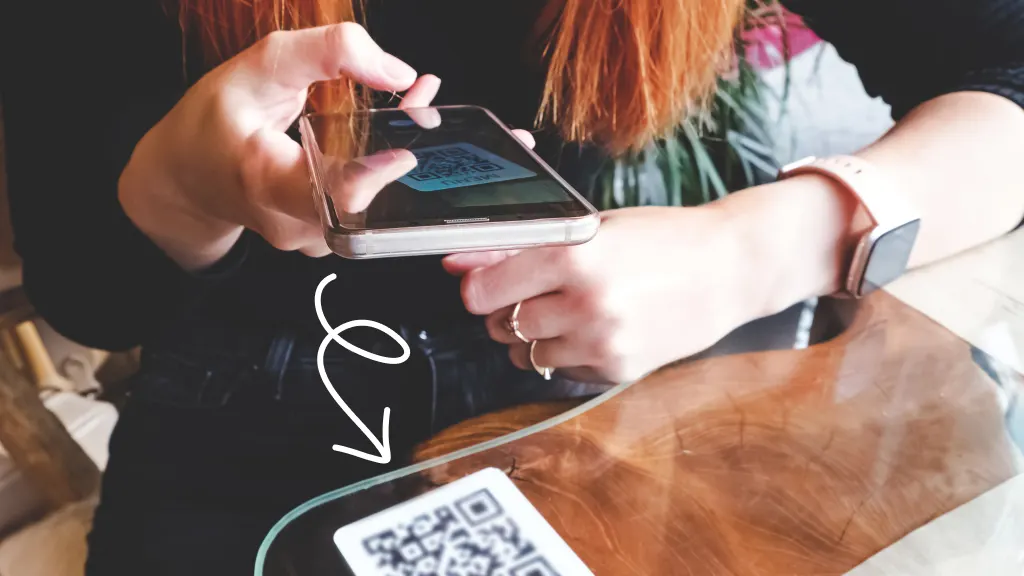 Woman scanning a QR Code on iPhone