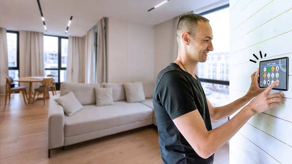 Man uses smart display mounted in the living room