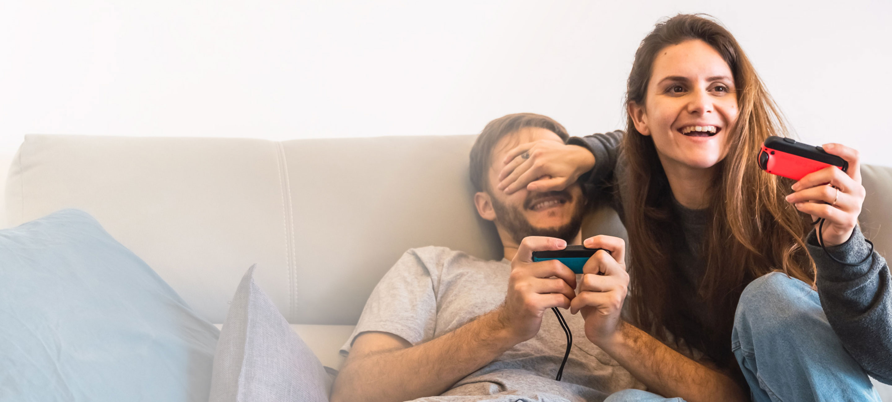 a couple playing video games with Nintendo game consoles