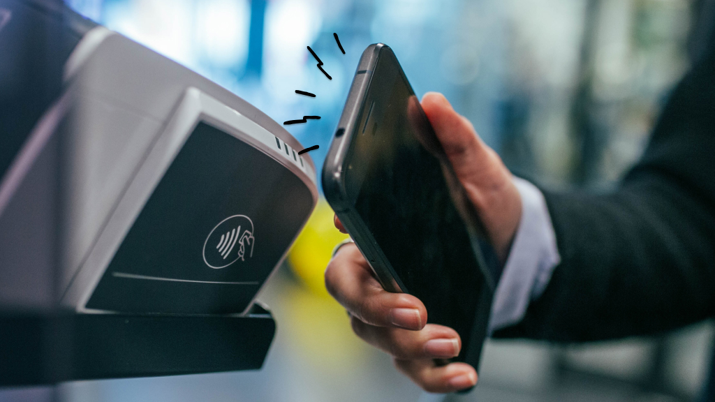 Persona paying with NFC using smartphone