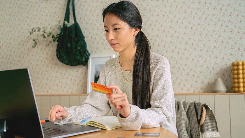 Woman shopping online with credit card