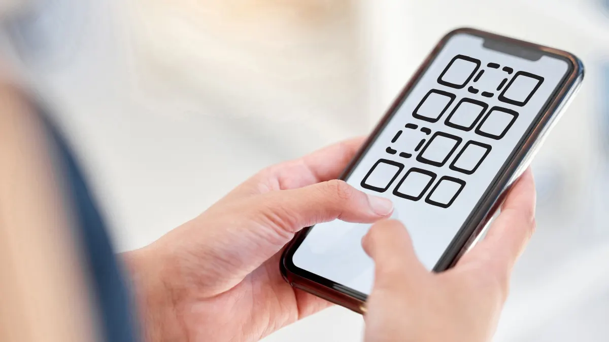 Woman deleting apps on iPhone