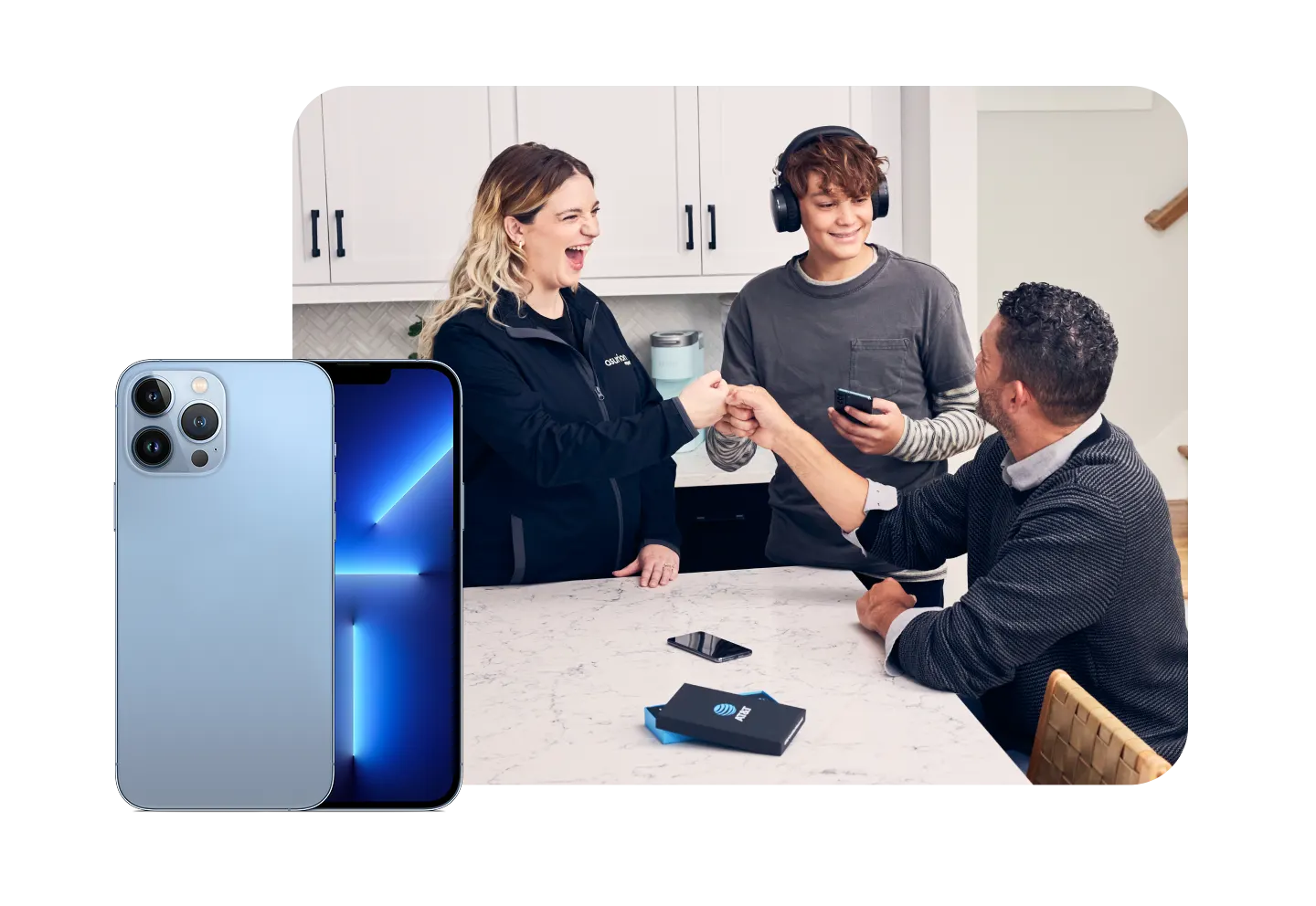 Family in kitchen with devices