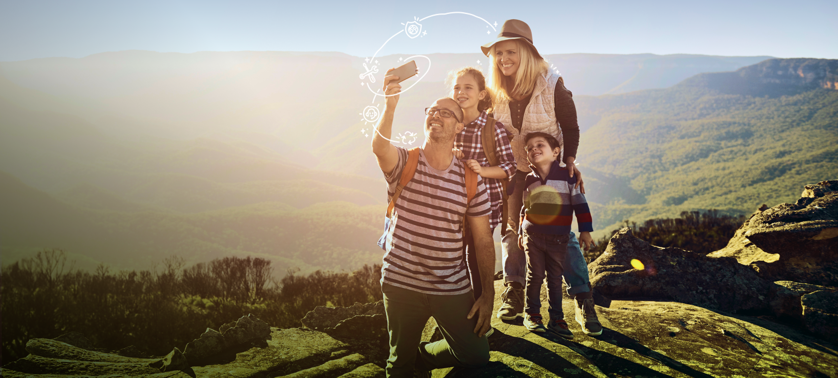 family taking photos on nature hike