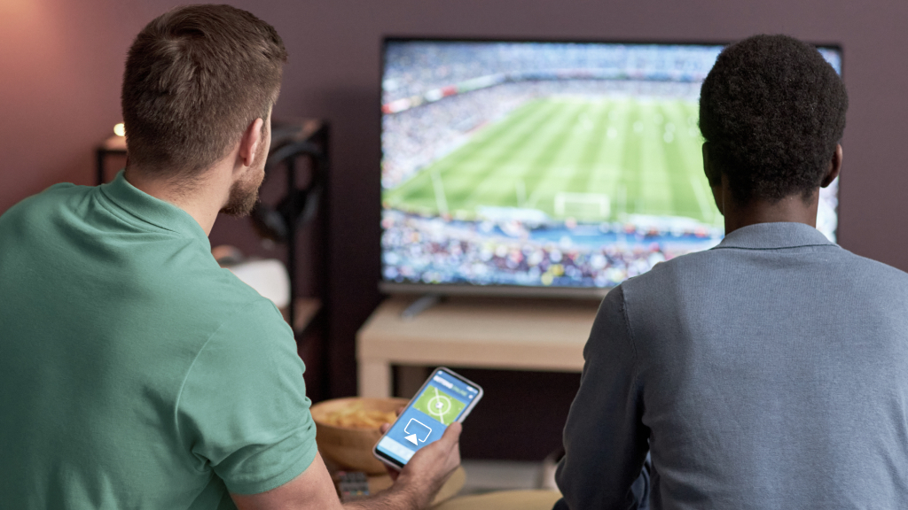 Men watching game through AirPlay
